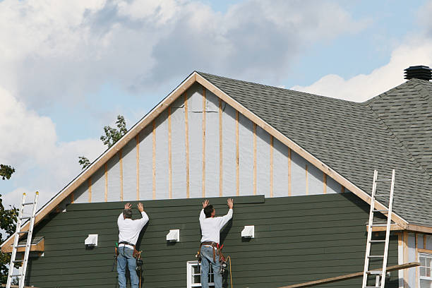 Professional Storm Damage Siding Repair technician working in Utica, PA